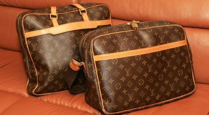 Two Louis Vuitton bags on a chair