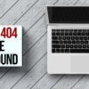 A laptop beside a error 404 sign