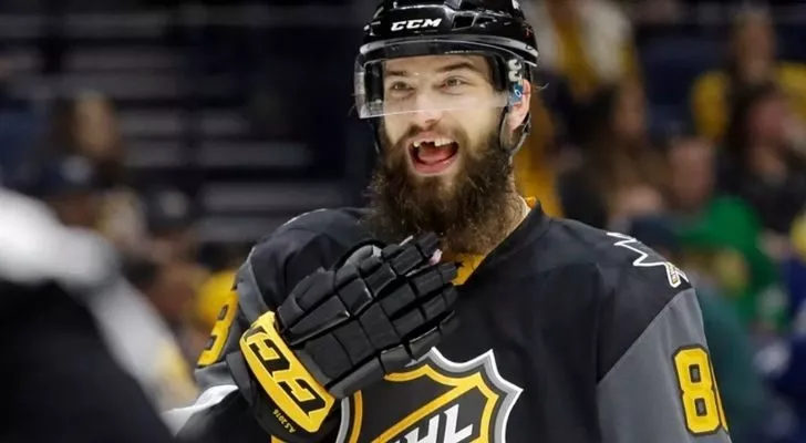 Hockey player missing some of his front teeth.