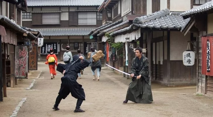 Samurai and ninja fighting on old Japanese streets