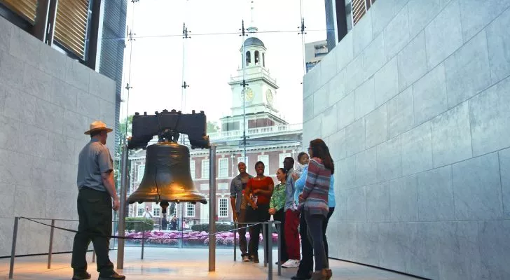 Tourists surrounding the Liberty Bell.