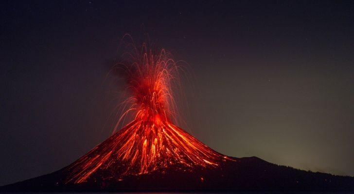 A volcano spouting red hot lava