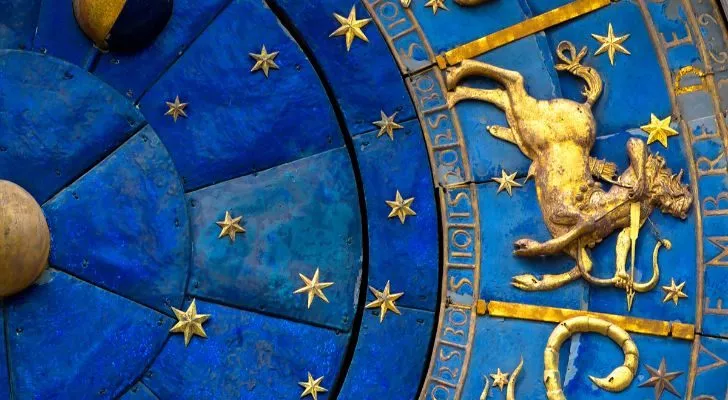 Sagittarius sign in blue and gold.