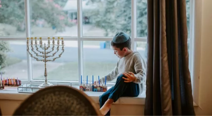 A boy celebrating Hanukkah