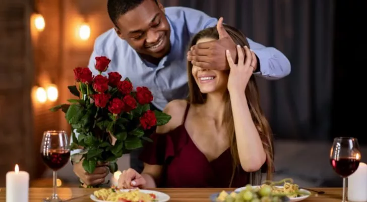 Someone gifting their partner with roses
