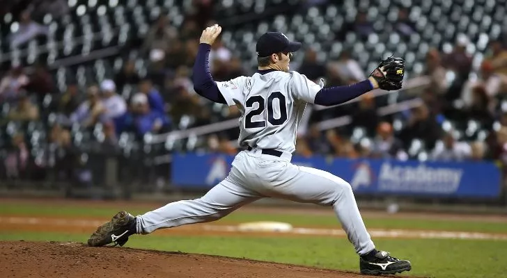 A baseball pitcher throwing a ball