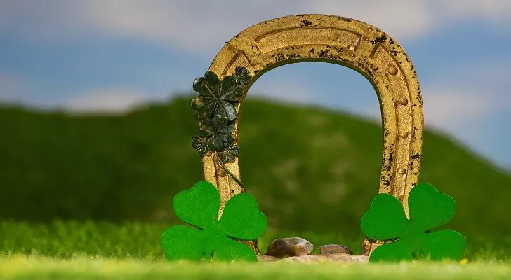 A collection of lucky clovers and a lucky horseshoe