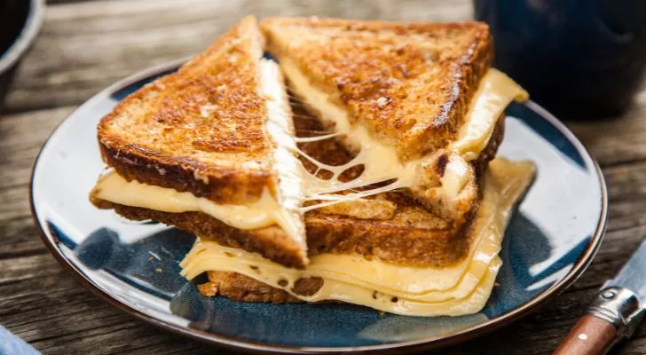 A delicious-looking extra cheesey grilled cheese sandwich on a plate