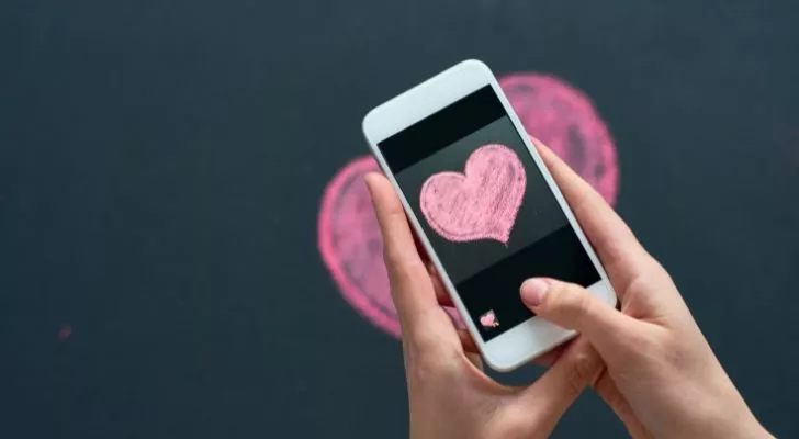 A phone taking a photo of a love heart