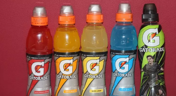 Five Gatorade bottles with the "G" logo in different flavors and colors