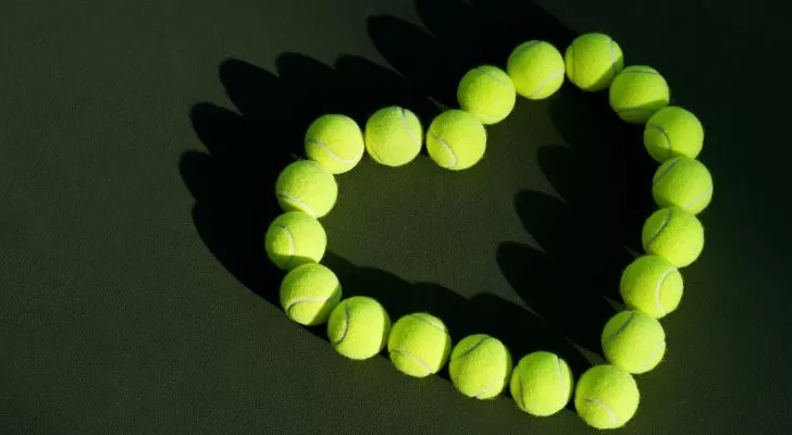 Tennis balls arranged into the shape of a love heart