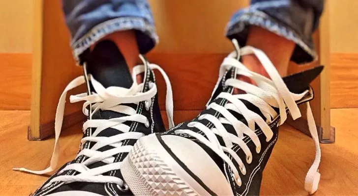 A pair of black Chuck Taylor Converse shoes