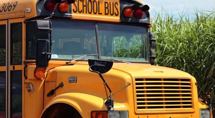 A close up of a bright yellow school bus