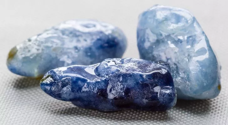 Three raw uncut sapphire gemstones
