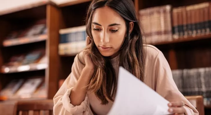 A female student looks over her notes