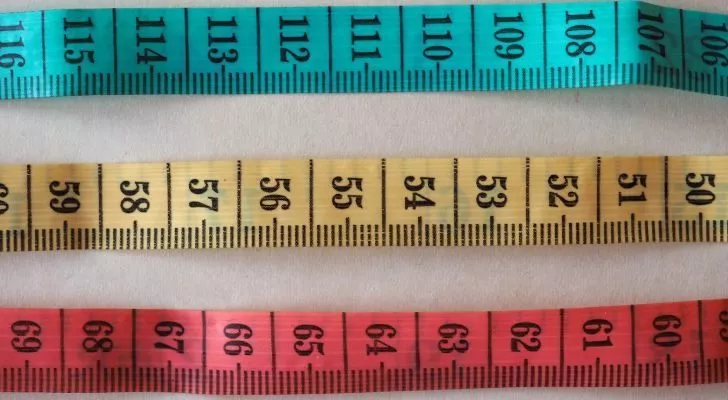 Three tape measures in different colors showing centimeters