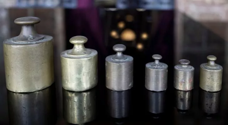 A selection of different metric weights lined up in size order