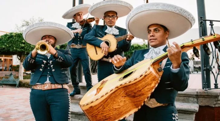 A mariachi band playing a song