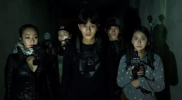 A group of Korean friends gather in the dark