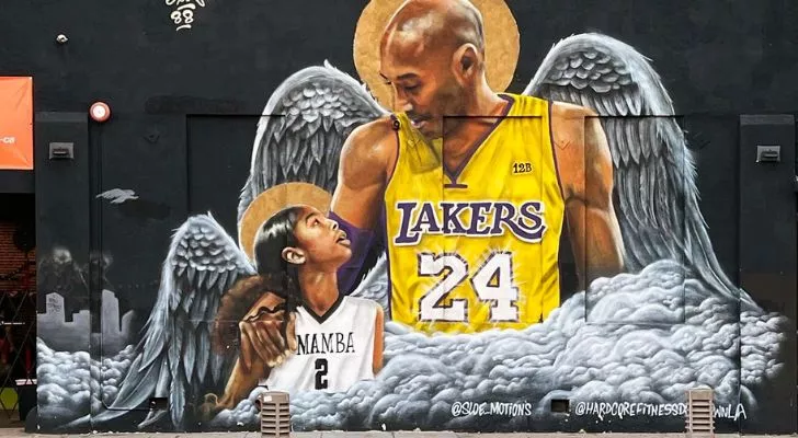 A mural depicting Kobe Bryant and his daughter with angel wings