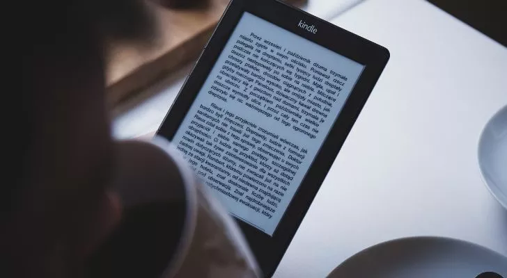 Someone reads from an Amazon Kindle e-reader