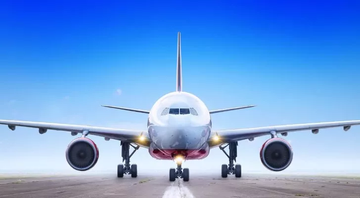 The front view of an airplane on a runway