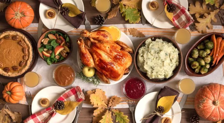 A large and varied Thanksgiving dinner laid out on a table