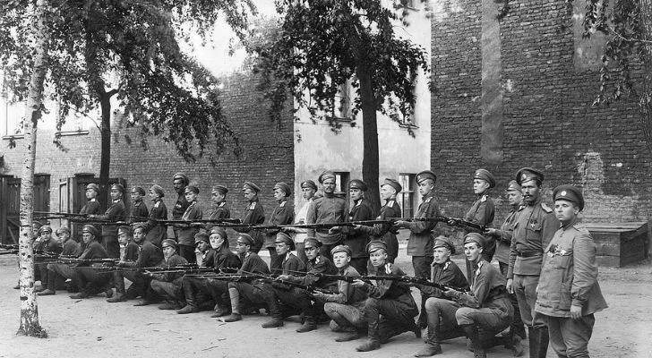 A group of Russian women in army uniforms hold their weapons ready