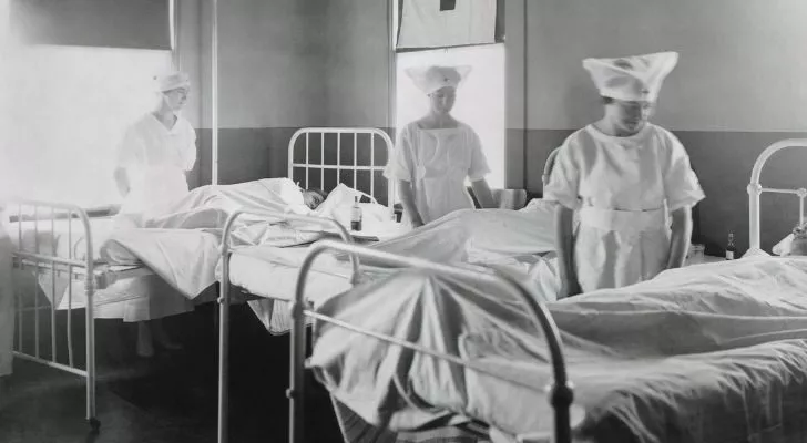 Nurses in a WWI hospital tend to their patients