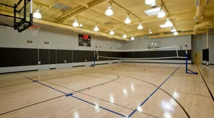 An empty gymnasium with the lights on