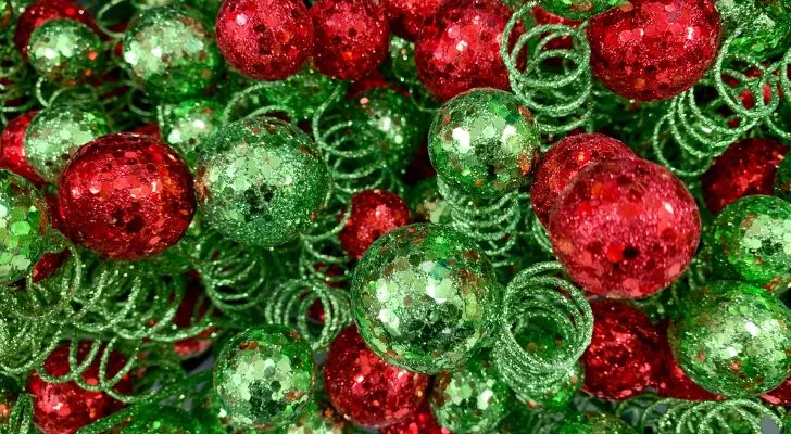 Green and red Christmas decorations pilled on top of each other