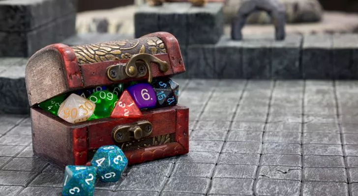 A miniature treasure chest full of dice