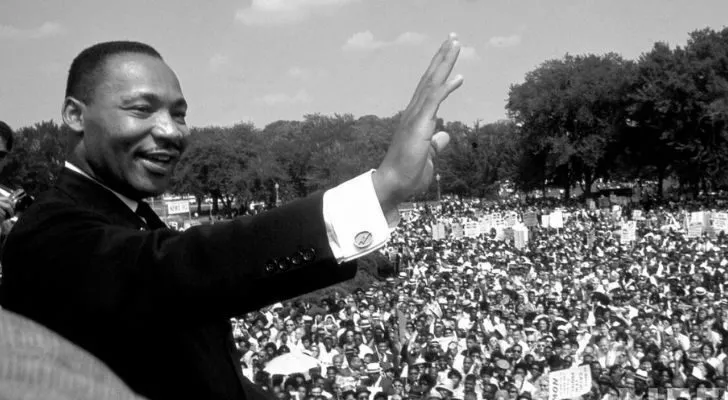 Martin Luther King Jr. addressing a large crowd of people