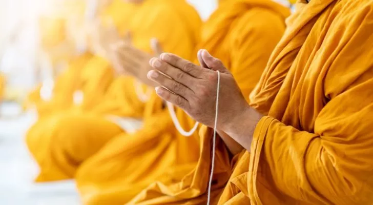 A group of Buddhist monks meditating together