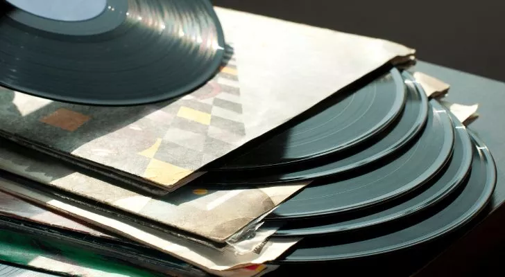 A collection of vinyl records stacked on top of each other