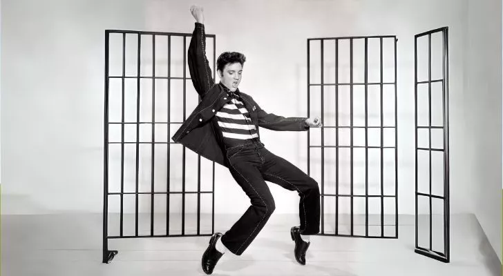 Elvis Presley striking a pose while dancing