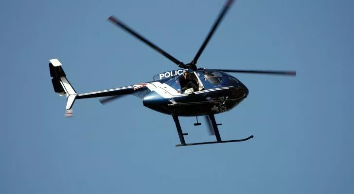 A police helicopter flying in the sky