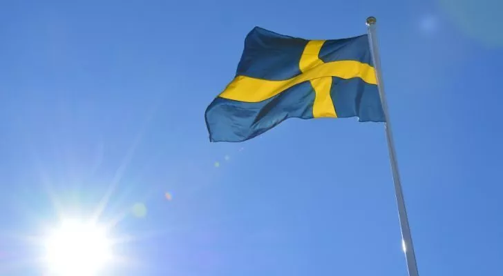 A Swedish flag flying in the sky