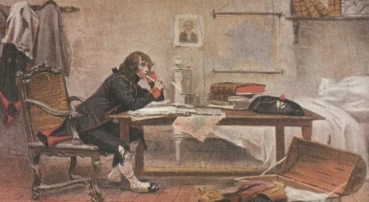 A bored looking Napoleon studying