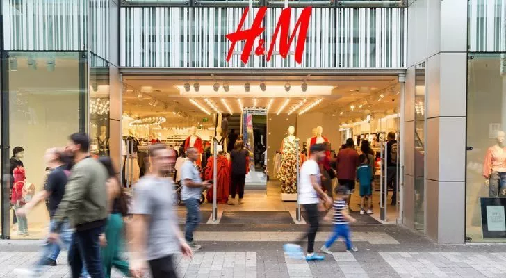 The front of an H&M store on a busy street
