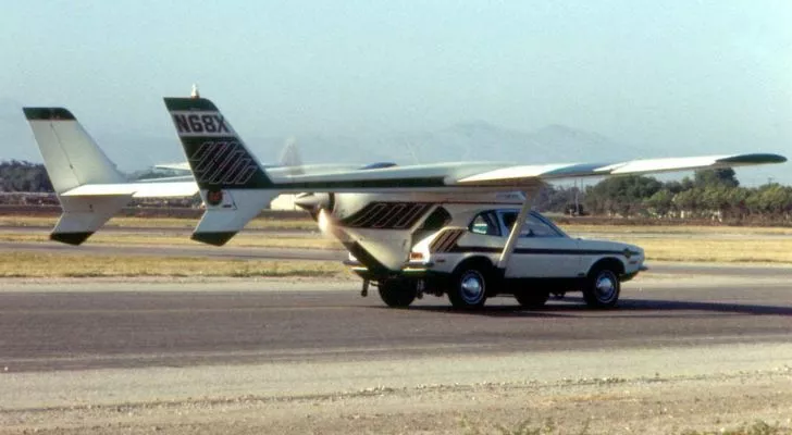 The AVE Mizar: A Ford Punto with wings and a propeller attached driving down a runway