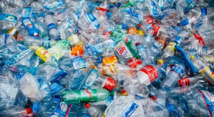 A large pile of used plastic bottles and containers