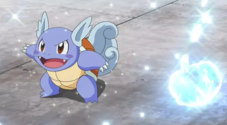 A Wartortle surrounded by drops of water sparkling in the air