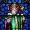 Stained glass window depicting Saint Patrick in traditional bishop attire holding a shamrock and a crosier