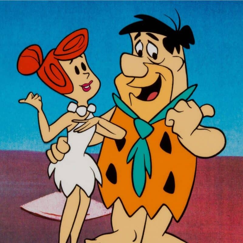 Fred and Wilma Flintstone standing together against a colorful background