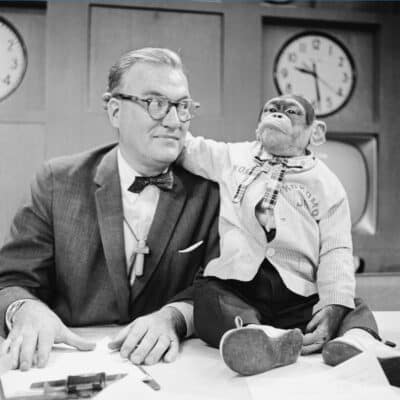 NBC’s Today Show co-host J. Fred Muggs, a chimpanzee, wearing a plaid tie and shirt