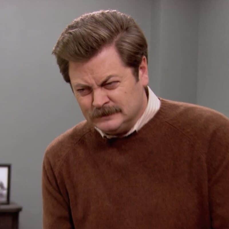 Ron Swanson wearing a brown sweater