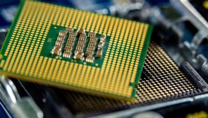 Close-up view of a microprocessor, highlighting the intricate patterns of silicon, relevant to the purification process discussed.