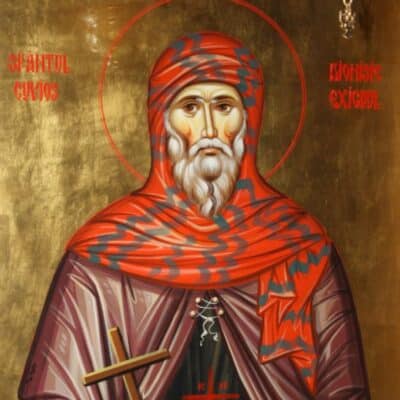 Illustration of a monk, Dionysius Exiguus, wearing a red and striped robe with a cross