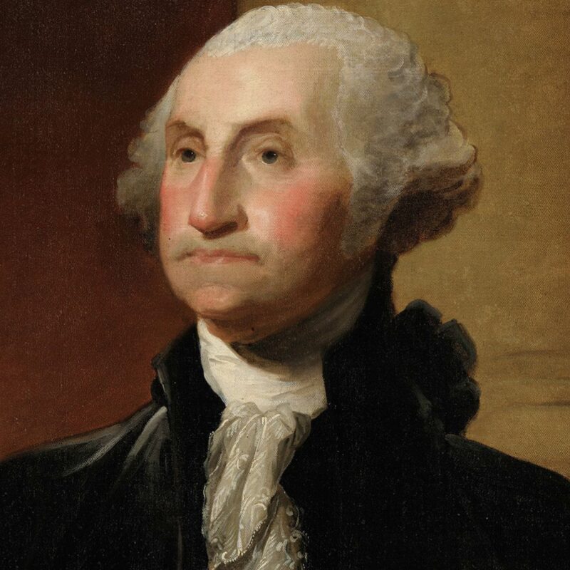 George Washington with white hair and a black coat